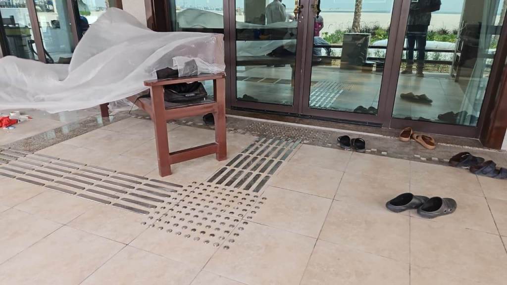 Interior view of Majlis Al Bahar showing stainless steel tactile pin-type studs and lines installed on the floor for accessibility enhancement.