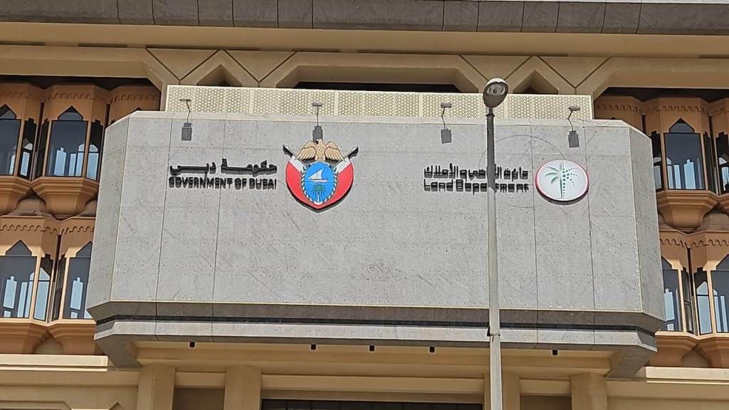 Facade of the Government of Dubai building featuring the logos of the Government and the Land Department